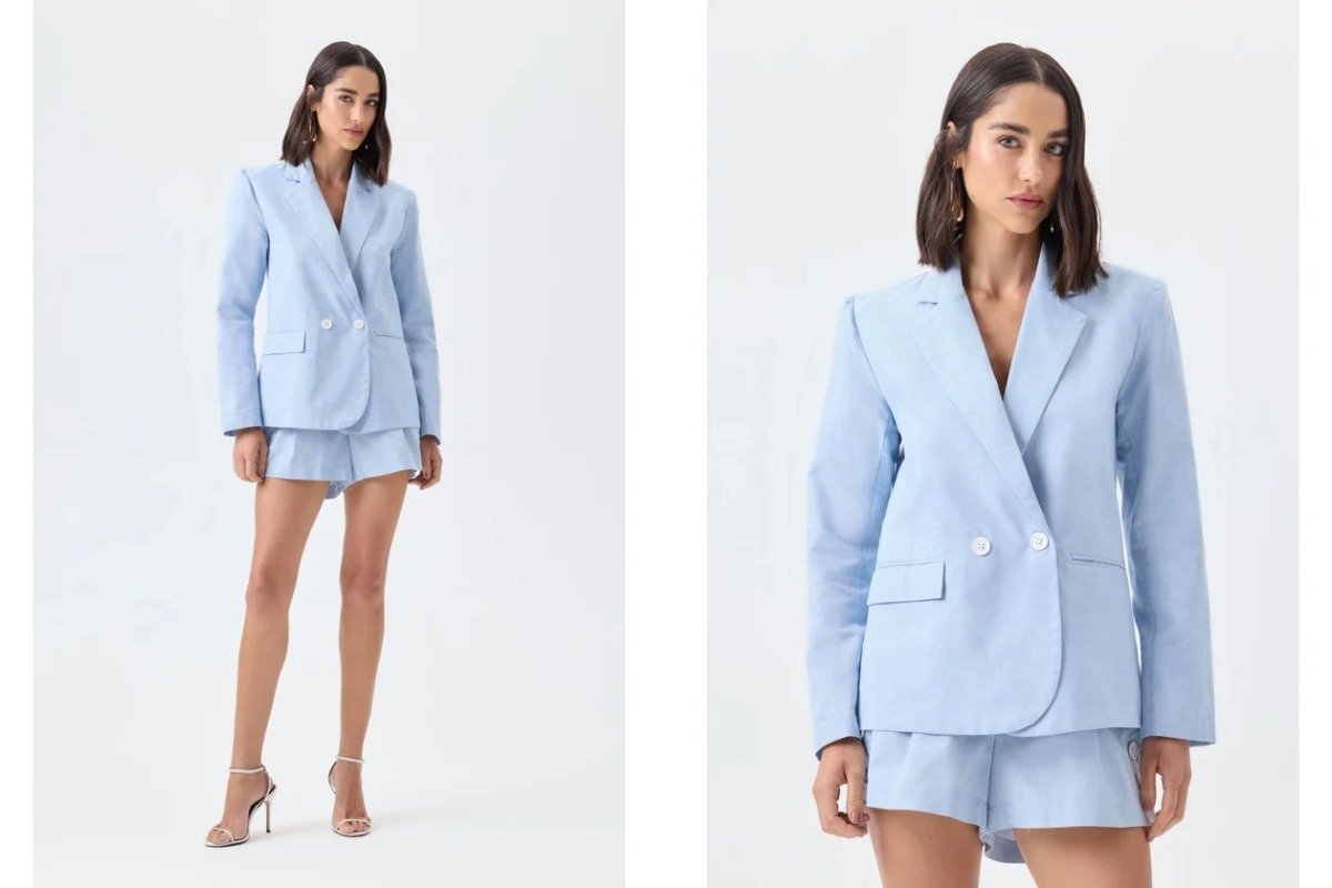 mulher usando com conjunto alfaiataria blazer e shorts azul