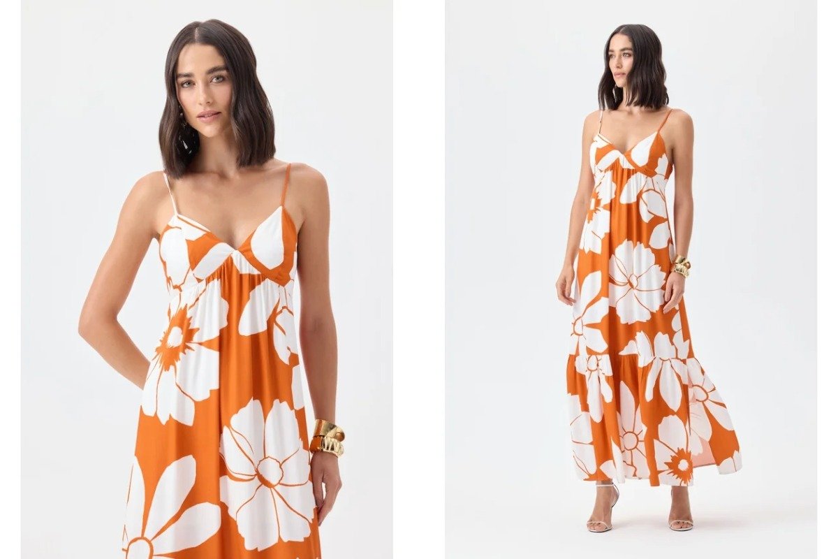 mulher usando vestido laranja com estampas de flores na cor branca